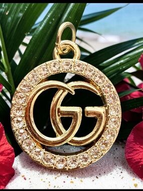 GUCCI GG Crystal Halo Charm Pendant – Gold Tone Double G Circle w/ Pavé Stones